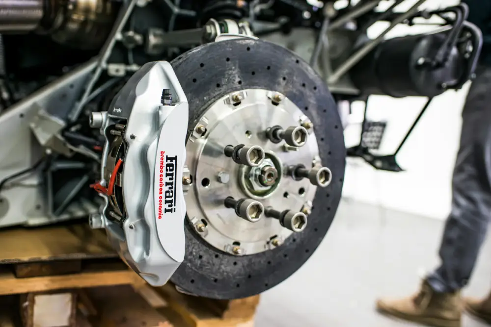 Mechanic performing brake repair service at Auto Car Repair workshop in Dubai